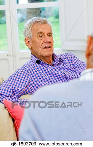Stock Photo - Senior men, chatting. Fotosearch