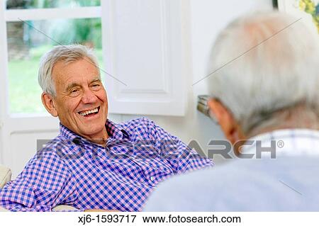 Stock Photo - Senior men, chatting. Fotosearch