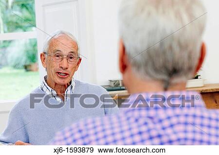 Senior men, chatting View Large Photo Image Stock Photo - Senior men, chatting. Fotosearch