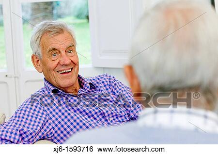 Stock Photograph - Senior men, chatting. Fotosearch