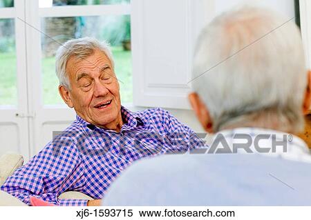 Stock Photography - Senior men, chatting. Fotosearch