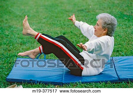 senior on a workout mat View Large Photo Image Stock Photo - senior on a workout mat. Fotosearch