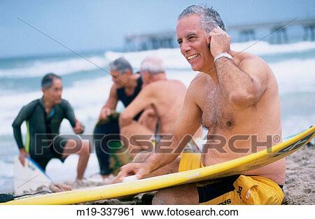 senior surfers, one on cellular View Large Photo Image Stock Image - senior surfers, one on cellular. Fotosearch
