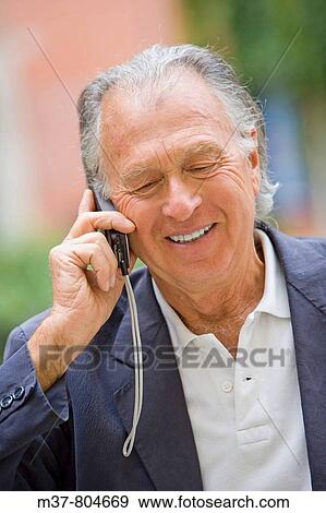 Stock Photo - Senior talking to cell phone. Rome, Italy. Fotosearch