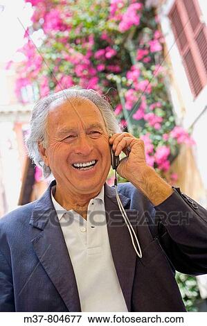 Stock Photo - Senior talking to cell phone. Rome, Italy. Fotosearch