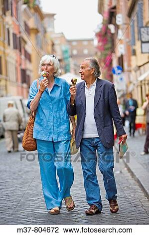 Senior tourists eating ice cream. Rome, Italy View Large Photo Image Stock Image - Senior tourists eating ice cream. Rome, Italy. Fotosearch