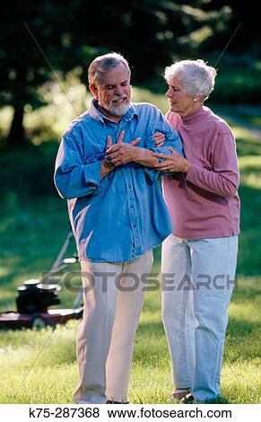 Senior with chest pain View Large Photo Image Stock Photo - Senior with chest pain. Fotosearch