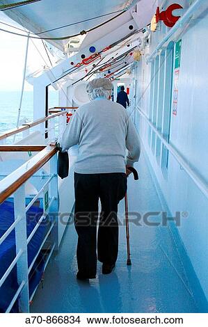Senior with going stick on cruise ship Coral, Louis Cruise LINEs. View Large Photo Image Picture - Senior with going stick on cruise ship Coral, Louis Cruise LINEs.. Fotosearch