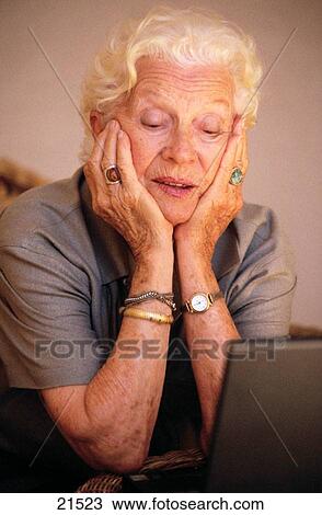 Stock Image - Senior woman, 89 years old, on computer. Fotosearch