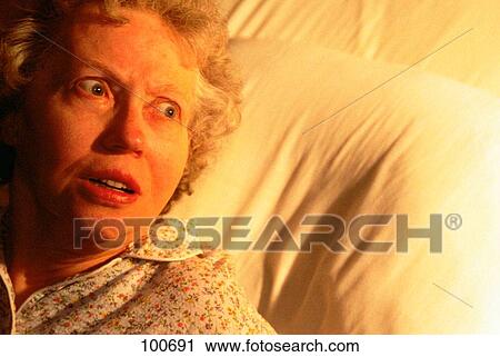 Senior woman afraid in bed View Large Photo Image Stock Image - Senior woman afraid in bed. Fotosearch