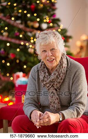 Senior woman at Christmas time View Large Photo Image Stock Image - Senior woman at Christmas time. Fotosearch