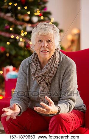 Senior woman at Christmas time View Large Photo Image Stock Photo - Senior woman at Christmas time. Fotosearch