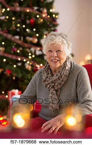 Senior woman at Christmas time View Large Photo Image Stock Photo - Senior woman at Christmas time. Fotosearch