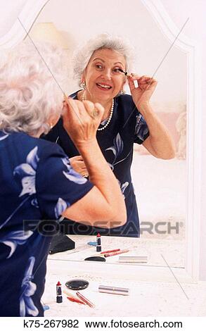 Senior woman getting ready for a night out View Large Photo Image Stock Image - Senior woman getting ready for a night out. Fotosearch
