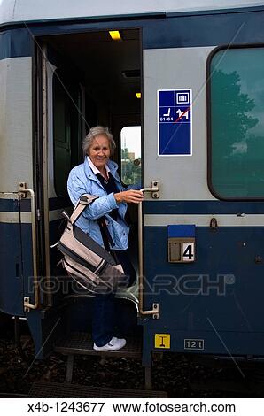 Senior woman going on a train trip Finland Europe View Large Photo Image Stock Photo - Senior woman going on a train trip Finland Europe. Fotosearch
