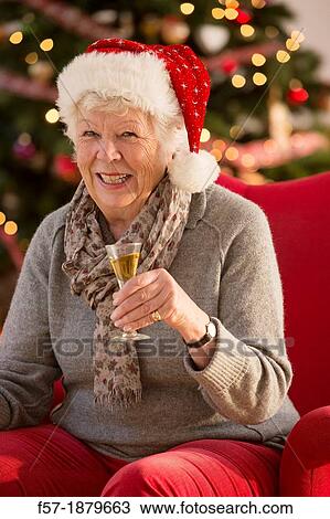 Senior woman having a catnap at Christmas time View Large Photo Image Stock Image - Senior woman having a catnap at Christmas time. Fotosearch