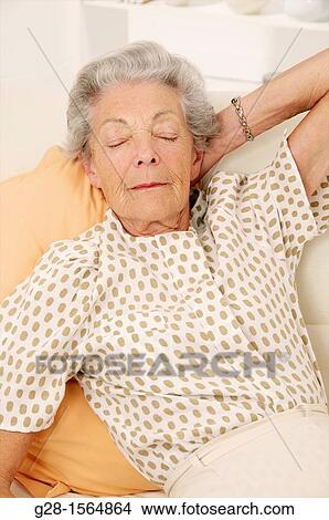 Senior woman having a nap and sleeping View Large Photo Image Picture - Senior woman having a nap and sleeping. Fotosearch