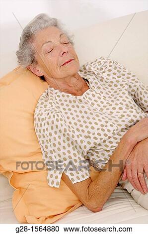 Senior woman having a nap and sleeping View Large Photo Image Stock Image - Senior woman having a nap and sleeping. Fotosearch