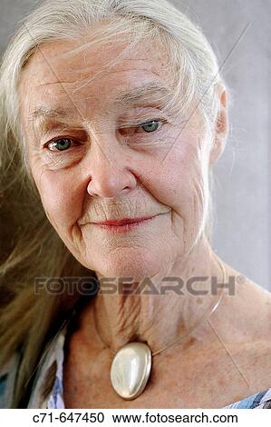 Stock Image - Senior woman looking in the camera. Fotosearch