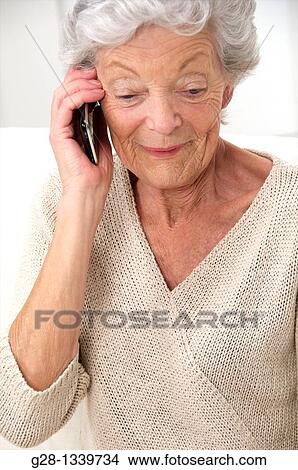 senior woman phoning with an i phone View Large Photo Image Picture - senior woman phoning with an i phone. Fotosearch