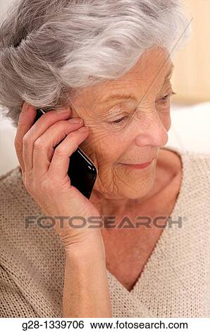 senior woman phoning with an i phone View Large Photo Image Stock Photograph - senior woman phoning with an i phone. Fotosearch