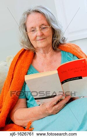 Senior woman reading a book View Large Photo Image Stock Image - Senior woman reading a book. Fotosearch
