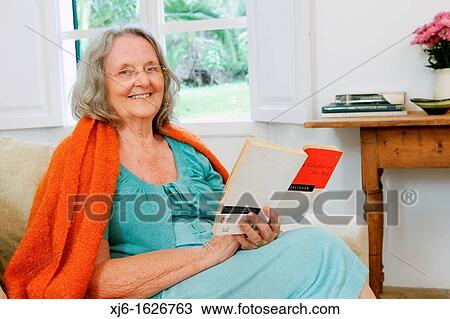Senior woman reading a book View Large Photo Image Stock Image - Senior woman reading a book. Fotosearch