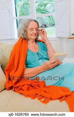 Senior woman reading a book View Large Photo Image Stock Photography - Senior woman reading a book. Fotosearch