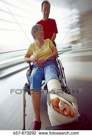 Senior woman recovering in a hospital wheelchair. View Large Photo Image Stock Image - Senior woman recovering in a hospital wheelchair.. Fotosearch