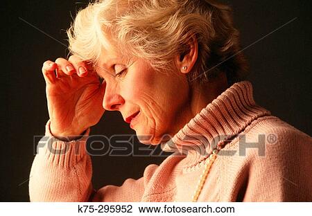 Stock Image - Senior woman showing concern. Fotosearch