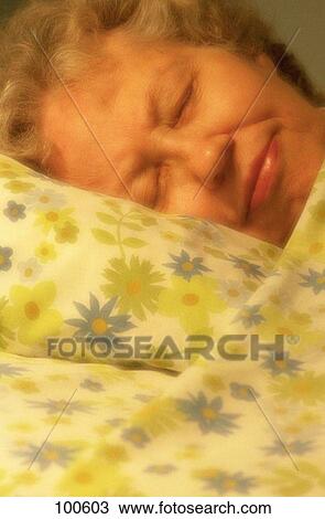 Stock Image - Senior woman sleeping. Fotosearch