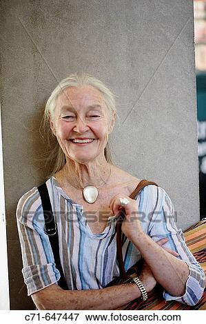 Senior woman smiling in the camera View Large Photo Image Stock Photo - Senior woman smiling in the camera. Fotosearch