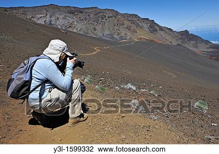 Senior woman taking photos during hike, Haleakala crater, Maui Island, Hawaii Islands, USA View Large Photo Image Stock Image - Senior woman taking photos during hike, Haleakala crater, Maui Island, Hawaii Islands, USA. Fotosearch