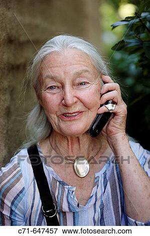 Senior woman talking on the cell phone View Large Photo Image Stock Photo - Senior woman talking on the cell phone. Fotosearch