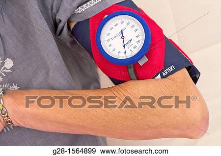 Senior woman with blood pressure gage, blood pressure test View Large Photo Image Stock Photo - Senior woman with blood pressure gage, blood pressure test. Fotosearch