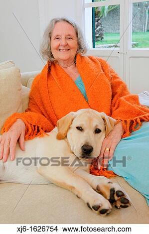 Senior woman with dog View Large Photo Image Picture - Senior woman with dog. Fotosearch