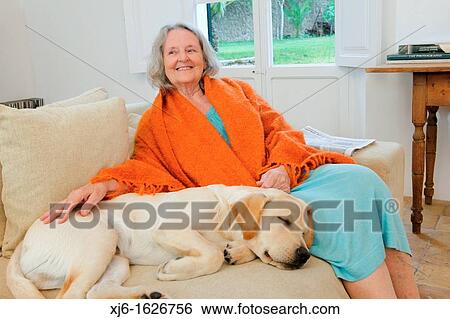 Stock Photograph - Senior woman with dog. Fotosearch