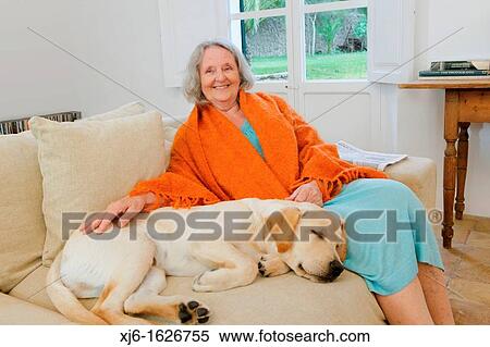 Stock Photography - Senior woman with dog. Fotosearch