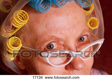 Senior woman with eyeglasses and hair in curlers View Large Photo Image Picture - Senior woman with eyeglasses and hair in curlers. Fotosearch