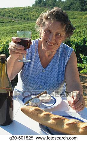 Senior woman with glass of wine. Provence. France View Large Photo Image Stock Photography - Senior woman with glass of wine. Provence. France. Fotosearch