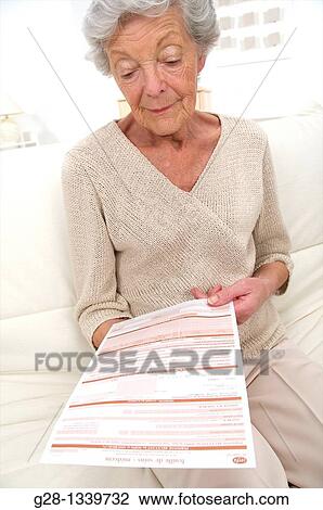 senior woman with medical papers in hand View Large Photo Image Stock Image - senior woman with medical papers in hand. Fotosearch