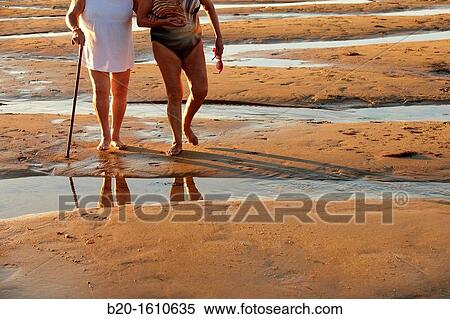 Stock Photography - Seniors walking, Zurriola Beach, Donostia, San Sebastian, Gipuzkoa, Basque Country, Spain. Fotosearch