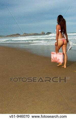 Sensual brazilian woman walking on the beach View Large Photo Image Stock Image - Sensual brazilian woman walking on the beach. Fotosearch