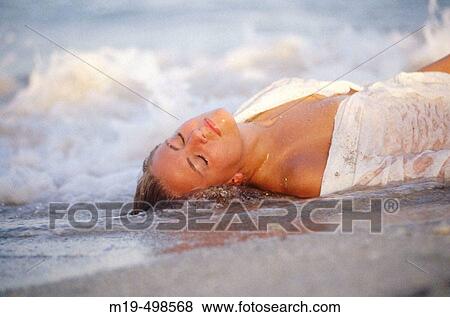 sensual girl lying in the surf View Large Photo Image Stock Photo - sensual girl lying in the surf. Fotosearch