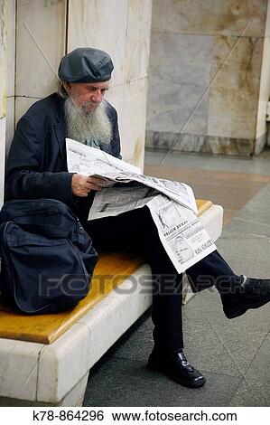 Sep 2008 - Man reading newspaper at the Metro station, Moscow, Russia View Large Photo Image Stock Photograph - Sep 2008 - Man reading newspaper at the Metro station, Moscow, Russia. Fotosearch