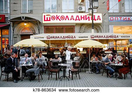 Sep 2008 - People sitting at outdoors cafe on Kamergersky pereulok Street next to Tverskaya Ulitsa street, Moscow, Russia View Large Photo Image Picture - Sep 2008 - People sitting at outdoors cafe on Kamergersky pereulok Street next to Tverskaya Ulitsa street, Moscow, Russia. Fotosearch