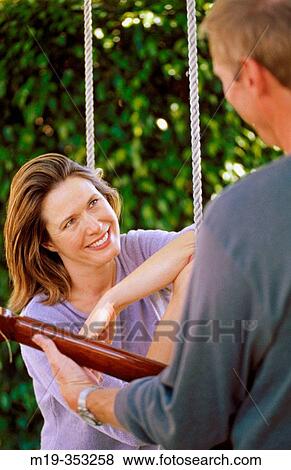 serenade on a swing View Large Photo Image Stock Photo - serenade on a swing. Fotosearch