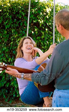 serenade on a swing View Large Photo Image Stock Photo - serenade on a swing. Fotosearch
