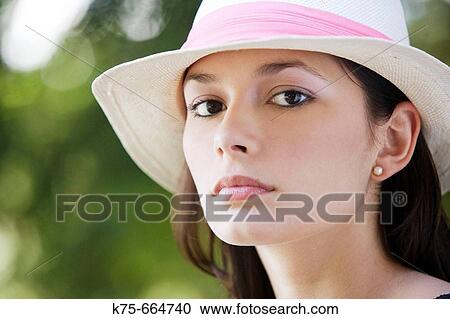 Serious woman wearing hat View Large Photo Image Stock Image - Serious woman wearing hat. Fotosearch