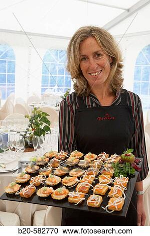 Serving canap? s. Tent for a wedding celebration. Divinus Catering, San Sebastian, Donostia, Gipuzkoa, Euskadi. Spain. View Large Photo Image Stock Image - Serving canap? s. Tent for a wedding celebration. Divinus Catering, San Sebastian, Donostia, Gipuzkoa, Euskadi. Spain.. Fotosearch